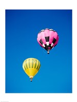 A Pink and a Yellow Hot Air Balloon Fine Art Print