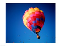 Lone Hot Air Balloon with Other Hot Air Balloons in the Distance Fine Art Print