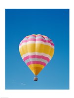 Low angle view of a hot air balloon in the sky, Albuquerque, New Mexico, Yellow & Pink Fine Art Print
