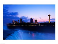 Waterfall with buildings lit up at dusk, American Falls, Niagara Falls, City of Niagara Falls, New York State, USA Fine Art Print