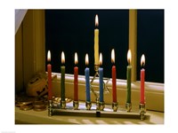 Close-up of a menorah with burning candles and a Star of David Fine Art Print