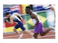 Side profile of two young men running on a running track Fine Art Print