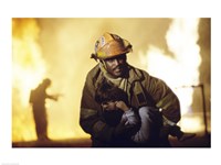 Firefighter carrying a boy Fine Art Print