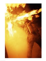 Fireman fighting with fire flames Fine Art Print