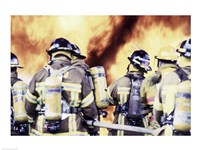 Rear view of a group of firefighters holding water hoses Fine Art Print