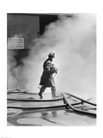 Firefighter walking in front of smoke Fine Art Print