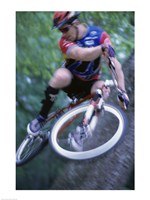 Young man on a bicycle Framed Print