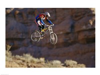 Side profile of a person on a bicycle in mid air Fine Art Print