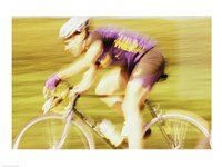 Side profile of a young man cycling Fine Art Print