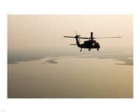 An Air Force helicopter flys over Lake Pontchatrain to New Orleans - various sizes