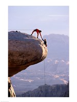Side profile of a young man pulling a young woman onto a rock - various sizes - $29.99