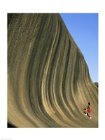 Person climbing Wave Rock, Western Australia, Australia Fine Art Print
