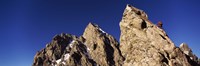 Low angle view of a man climbing up a mountain, Rockchuck Peak, Grand Teton National Park, Wyoming, USA Fine Art Print