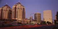 USA, California, Oakland, Alameda County, New City Center, Buildings lit up at night Fine Art Print