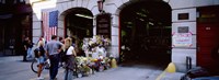 Rear view of three people standing in front of a memorial at a fire station, New York City, New York State, USA Fine Art Print
