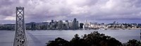 Bridge across a bay with city skyline in the background, Bay Bridge, San Francisco Bay, San Francisco, California, USA Fine Art Print