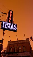 Low angle view of a neon sign of a hotel lit up at dusk, Fort Worth Stockyards, Fort Worth, Texas, USA Fine Art Print