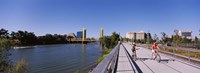 Bicyclists along the Sacramento River with Tower Bridge in background, Sacramento, Sacramento County, California, USA Fine Art Print