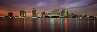 Buildings lit up at the waterfront, New Orleans, Louisiana, USA Fine Art Print