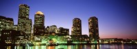 Skyscrapers at the waterfront lit up at night, Boston, Massachusetts, USA Fine Art Print