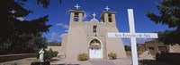 Cross in front of a church, San Francisco de Asis Church, Ranchos De Taos, New Mexico, USA Fine Art Print