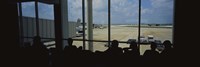 Silhouette of a group of people at an airport lounge, Orlando International Airport, Orlando, Florida, USA Fine Art Print