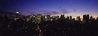 Skyscrapers in a city lit up at night, Manhattan, New York City, New York State, USA Fine Art Print