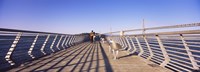 Couple walking on a pier, Bay Bridge, San Francisco, California, USA Fine Art Print
