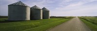 Three silos in a field Fine Art Print