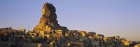 Low angle view of a rock formation in a village, Cappadocia, Turkey Fine Art Print