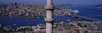 Mid section view of a minaret with bridge across the bosphorus in the background, Istanbul, Turkey Fine Art Print