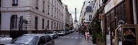 Buildings along a street with the Eiffel Tower in the background, Paris, France Fine Art Print