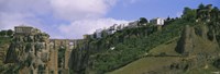 Low angle view of a town, Tajo Bridge, Rio Guadalevin Gorge, Serrania De Ronda, Ronda, Andalusia, Spain Fine Art Print