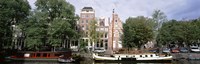 Netherlands, Amsterdam, Boats in canal Fine Art Print