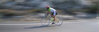 Bike racer participating in a bicycle race, Sitges, Barcelona, Catalonia, Spain by Panoramic Images - 27" x 9"