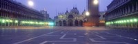 Street lights lit up in front of a cathedral at sunrise, St. Mark's Cathedral, St. Mark's Square, Venice, Veneto, Italy Fine Art Print