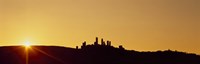 Silhouette of a town on a hill at sunset, San Gimignano, Tuscany, Italy by Panoramic Images - 27" x 9"