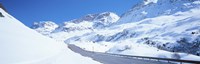 Snow covered mountains on both sides of a road, St Moritz, Graubunden, Switzerland Fine Art Print