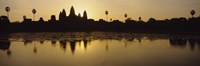 Silhouette Of A Temple At Sunrise, Angkor Wat, Cambodia by Panoramic Images - 27" x 9"