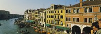 Tourists looking at gondolas in a canal, Venice, Italy Fine Art Print