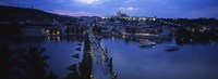 High angle view of buildings lit up at dusk, Charles Bridge, Vltava River, Prague, Czech Republic Fine Art Print