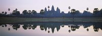 Reflection of temples and palm trees in a lake, Angkor Wat, Cambodia Fine Art Print