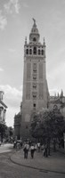 Group of people walking near a church, La Giralda, Seville Cathedral, Seville, Seville Province, Andalusia, Spain by Panoramic Images - 9" x 27"