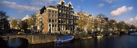 Boats and Buildings along a canal, Amsterdam, Netherlands Fine Art Print
