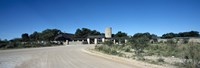 Road leading towards the entrance of a rest camp, Okaukuejo, Etosha National Park, Kunene Region, Namibia Fine Art Print