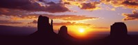 Silhouette of buttes at sunset, Monument Valley, Utah by Panoramic Images - 27" x 9"
