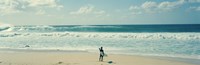 Surfer standing on the beach, North Shore, Oahu, Hawaii Fine Art Print