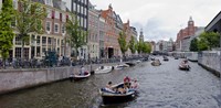 Tourboats in a canal, Amsterdam, Netherlands Fine Art Print