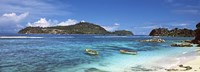 Small fishing boats on Anse L'Islette with Therese Island in background, Seychelles Fine Art Print