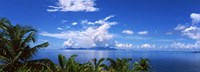 Indian ocean with palm trees towards Mahe Island looking from North Island, Seychelles Fine Art Print